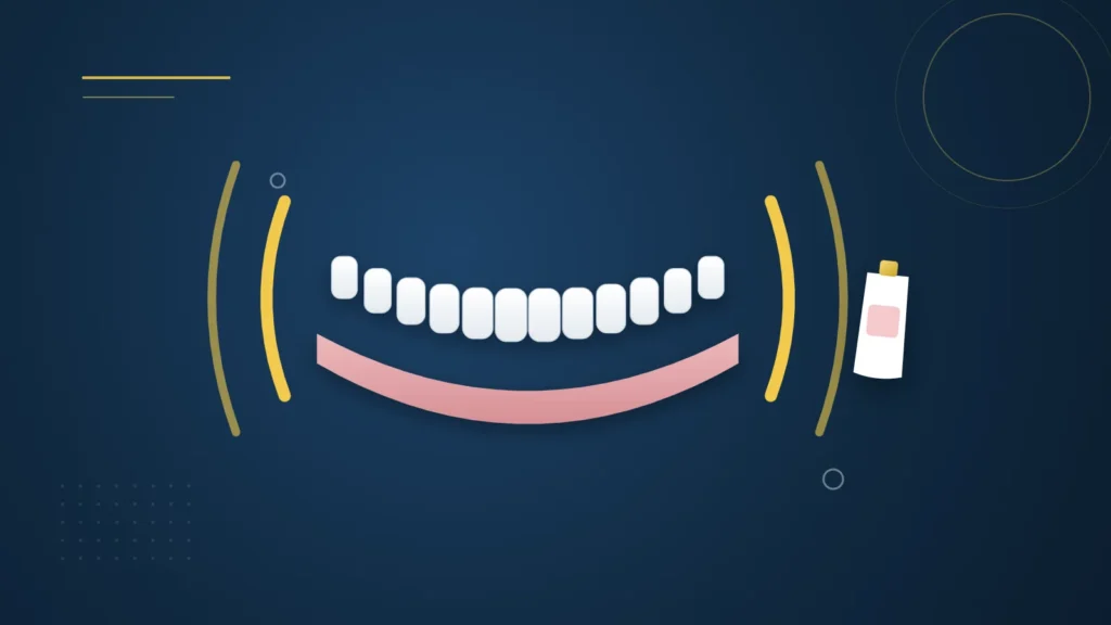 Illustration : une prothèse dentaire complète instable et un tube de crème adhésive